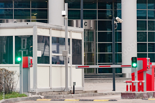 The protective barrier and security office at the entrance to the office parking lot