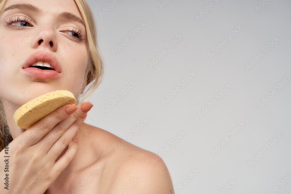 beautiful woman holding a spoon at the chin beautiful woman holding a spoon at the chin