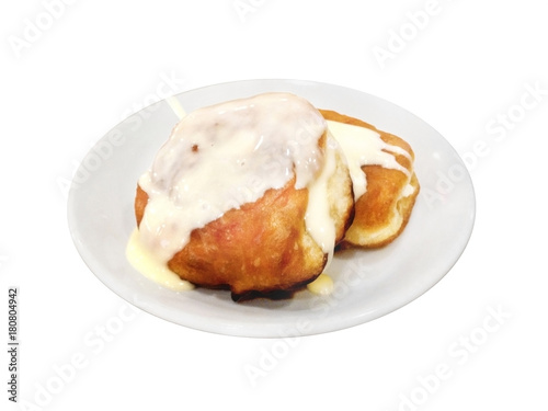 Fritters With Condensed Milk On Plate. Isolated On White.