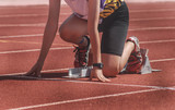 Cropped image of a sprinter getting ready to start at the stadium