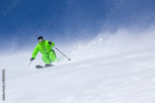 A skier on the slope. Powder day.