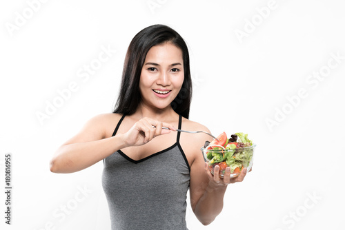 portrait of a healthy woman eating a salad