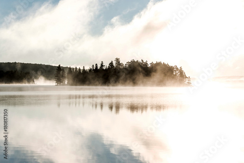Lake of two rivers algonquin national park ontario canada sunset sunrise with fog foggy mystical atmosphere background photo