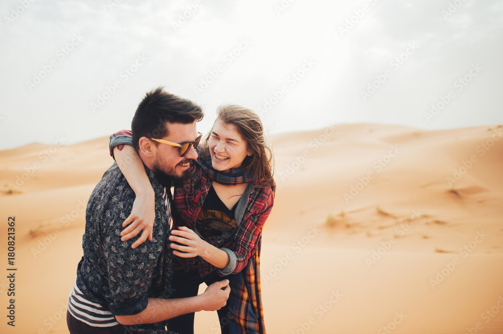 Loving couple in the Sahara Desert. Morocco. Loving couple in the Sahara Desert. Morocco.