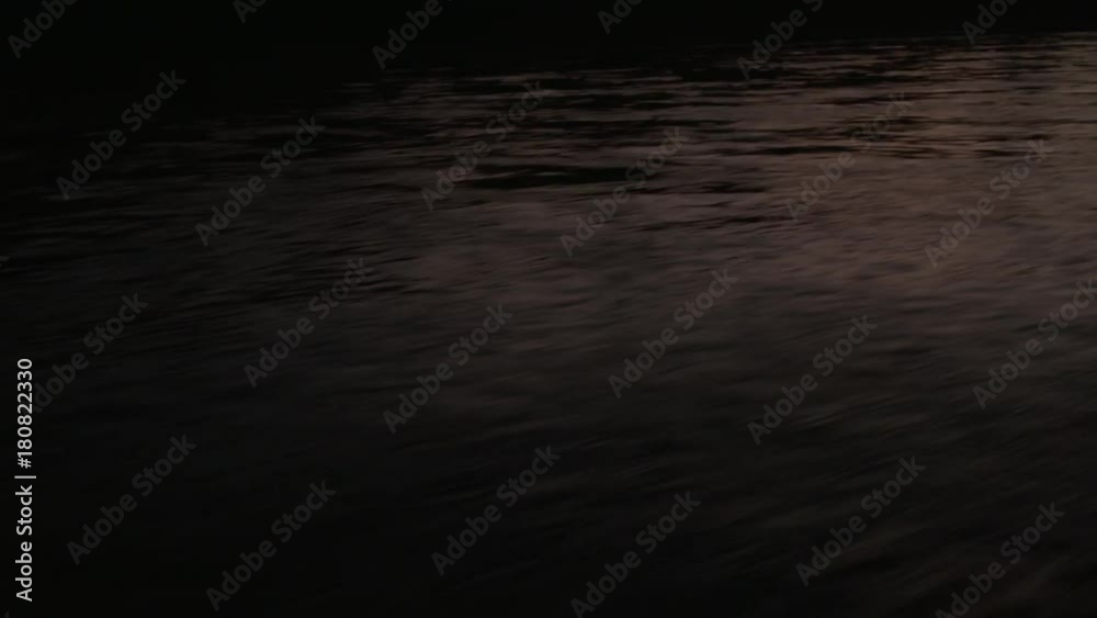 POV, boat skims across lake at sunset POV, boat skims across lake at sunset