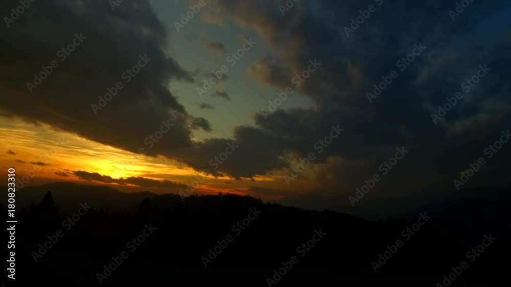 Observing beautiful bold colors of sunset sky with clouds and intensive colors of setting down sun. Observing beautiful bold colors of sunset sky with clouds and intensive colors of setting down sun.
