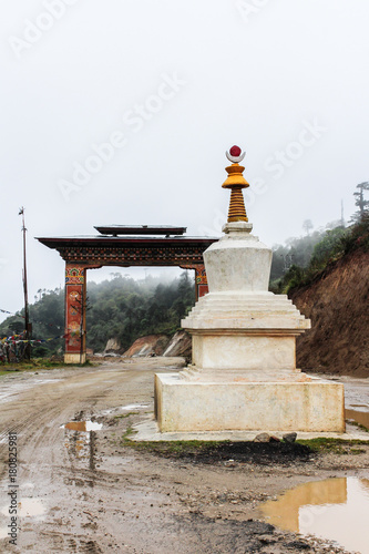 View of a white Chorten (Stupa) in a rainy day near Bumthang, Bhutan.
