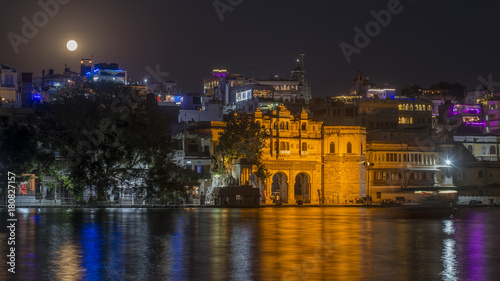Full moon over the Gangaur Ghat from Lake Pichola, Udaipur, Rajasthan, India