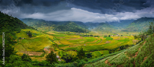 Rice fields on terraced with wooden pavilion at dramatic sky in Sa Pa, YenBai, Vietnam.