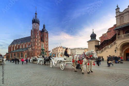 Horse carriages at the Main Square in Krakow, Poland