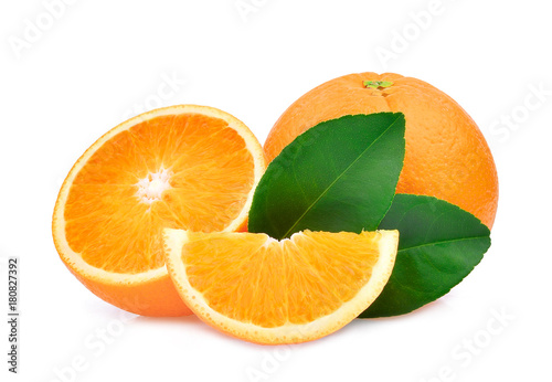 whole and half of orange fruit with green leaves isolated on white background