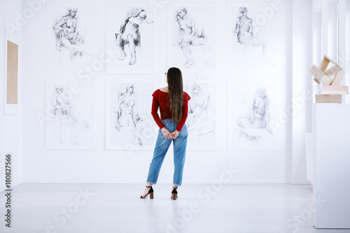 Fashionable woman looking at display