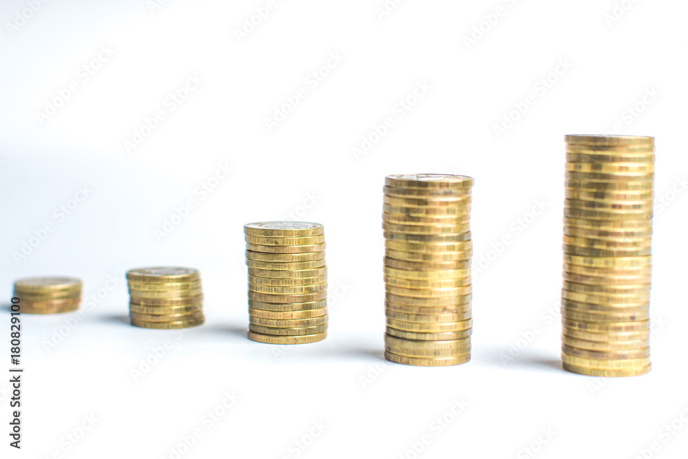 Coin stacks on white background different heights Coin stacks on white background different heights