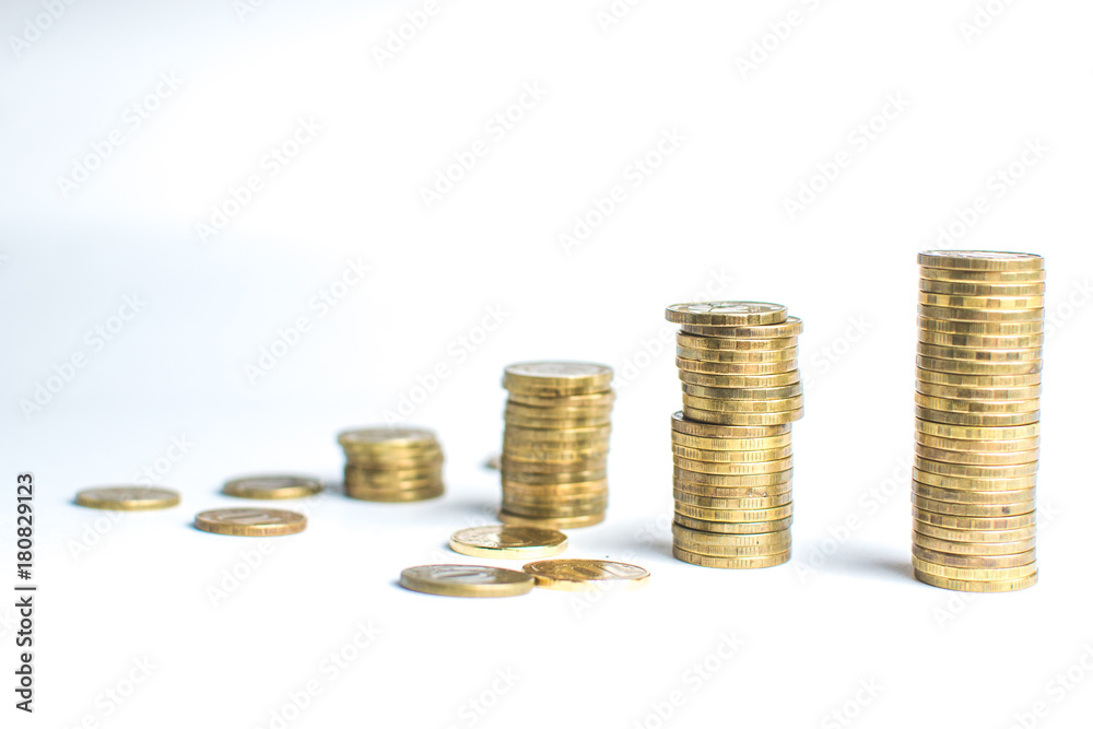 Coin stacks on white background different heights Coin stacks on white background different heights