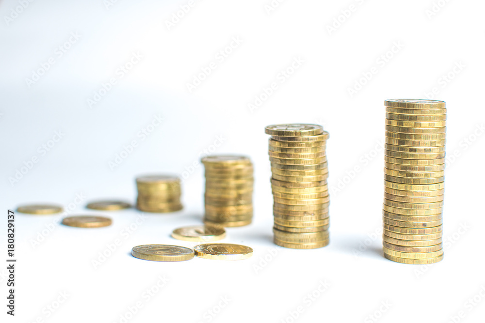 Coin stacks on white background different heights Coin stacks on white background different heights