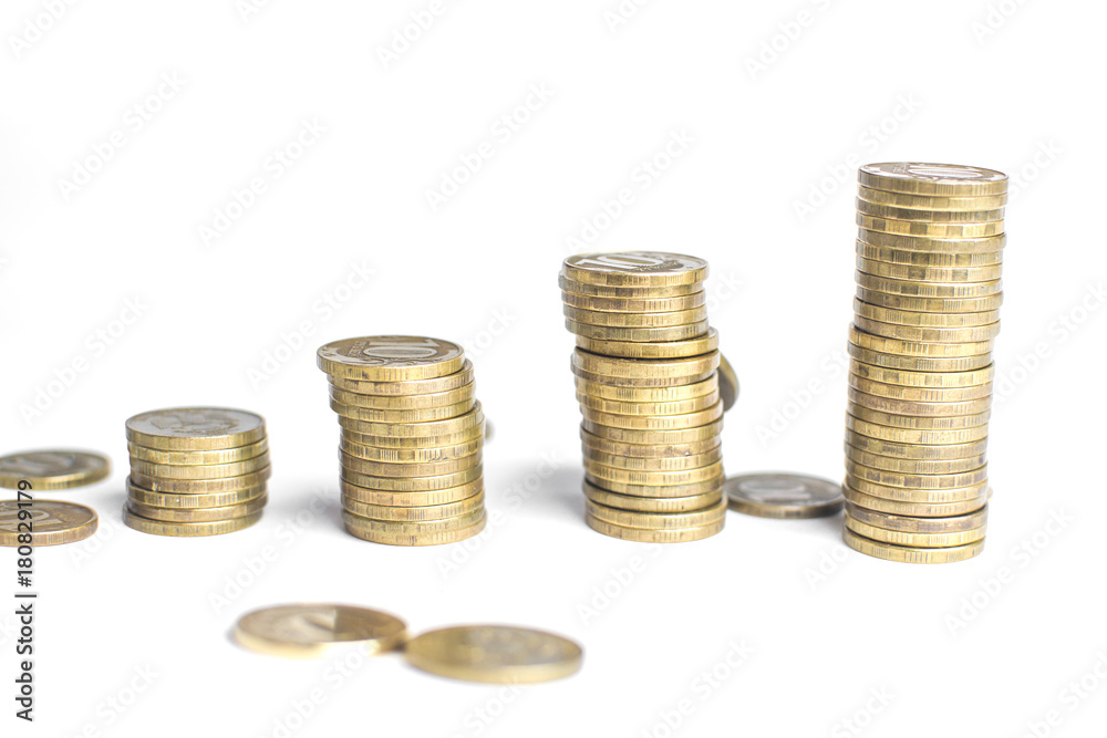 Coin stacks on white background different heights Coin stacks on white background different heights