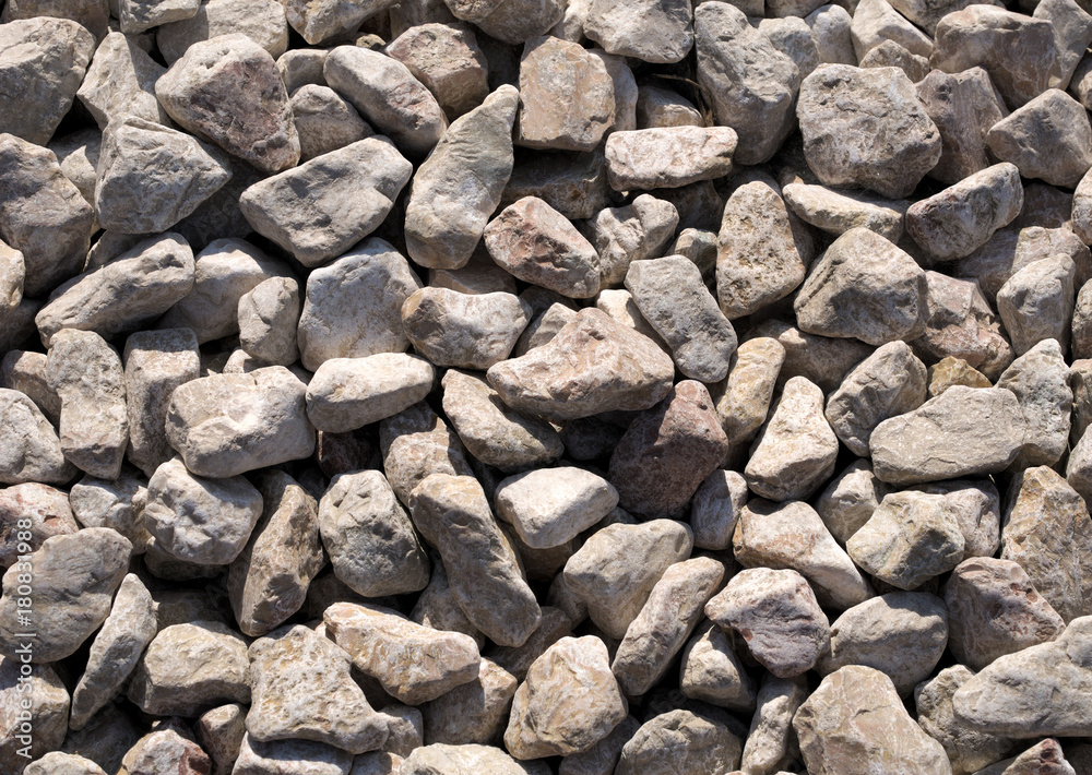 large gray stones on the shore, texture of light stones, natural background. large gray stones on the shore, texture of light stones, natural background.