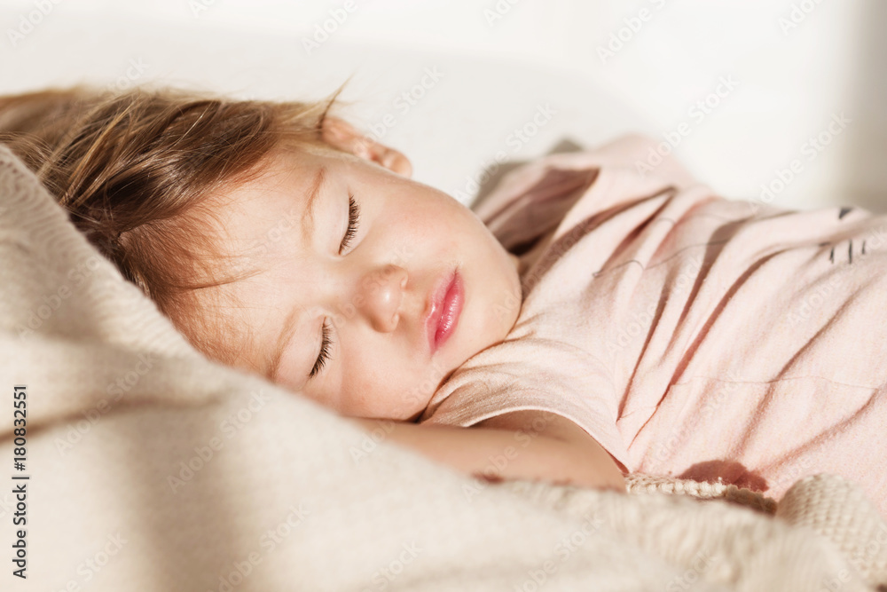 Sleeping little girl. Carefree sleep little baby with a soft toy on the bed. Sleeping little girl. Carefree sleep little baby with a soft toy on the bed.