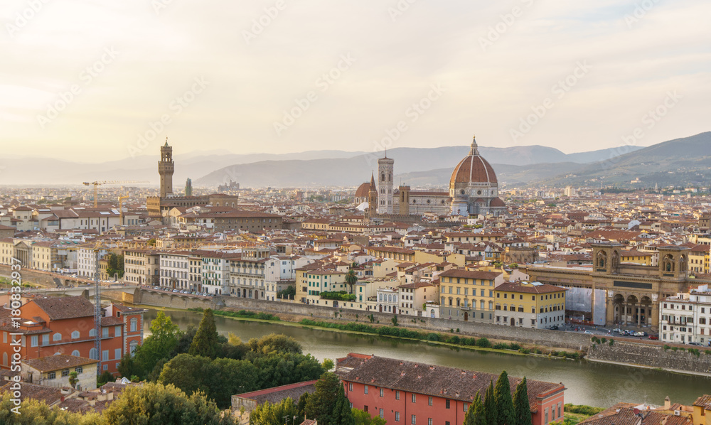 Florence city panorama with Arno river and Santa Maria del Fiore cathedral at sunset.