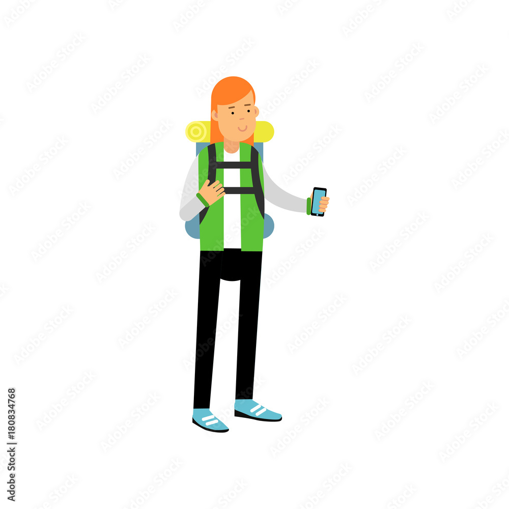 Red-haired girl in camping outfit with backpack on her shoulders standing and taking photo on smartphone. Camping or hiking design concept Red-haired girl in camping outfit with backpack on her shoulders standing and taking photo on smartphone. Camping or hiking design concept