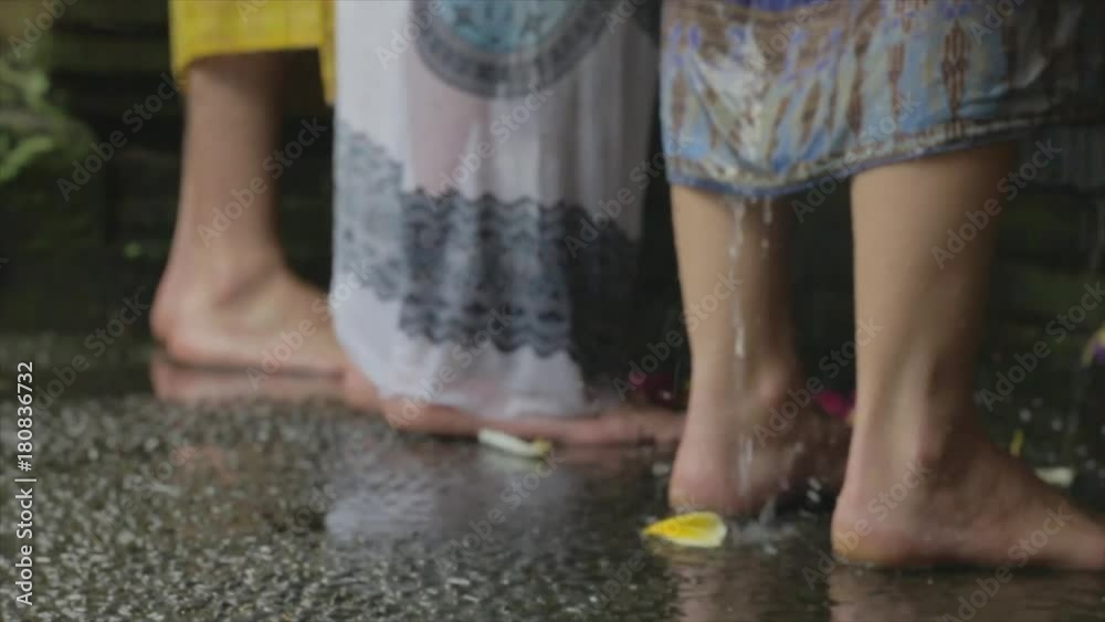 Water drips down legs during water purification blessing. Water drips down legs during water purification blessing.