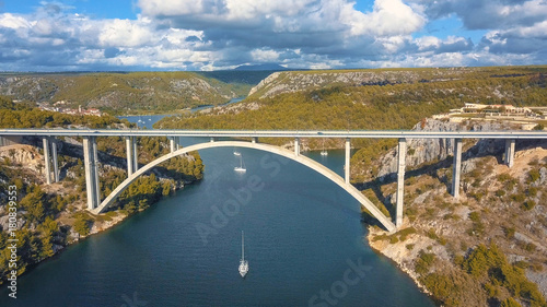 Aerial panorama view with bridge and sea around islands. Beautiful landscape surrounded with blue sea with bridge.