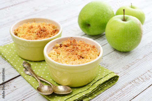 Apple crumble in small baking dish photo