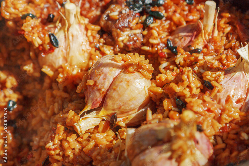 Preparation of pilaf on fire. Tourist bowler with food on bonfire, cooking in the hike, outdoor. Preparation of pilaf on fire. Tourist bowler with food on bonfire, cooking in the hike, outdoor.