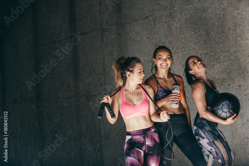 Group of female friends relaxing after workout