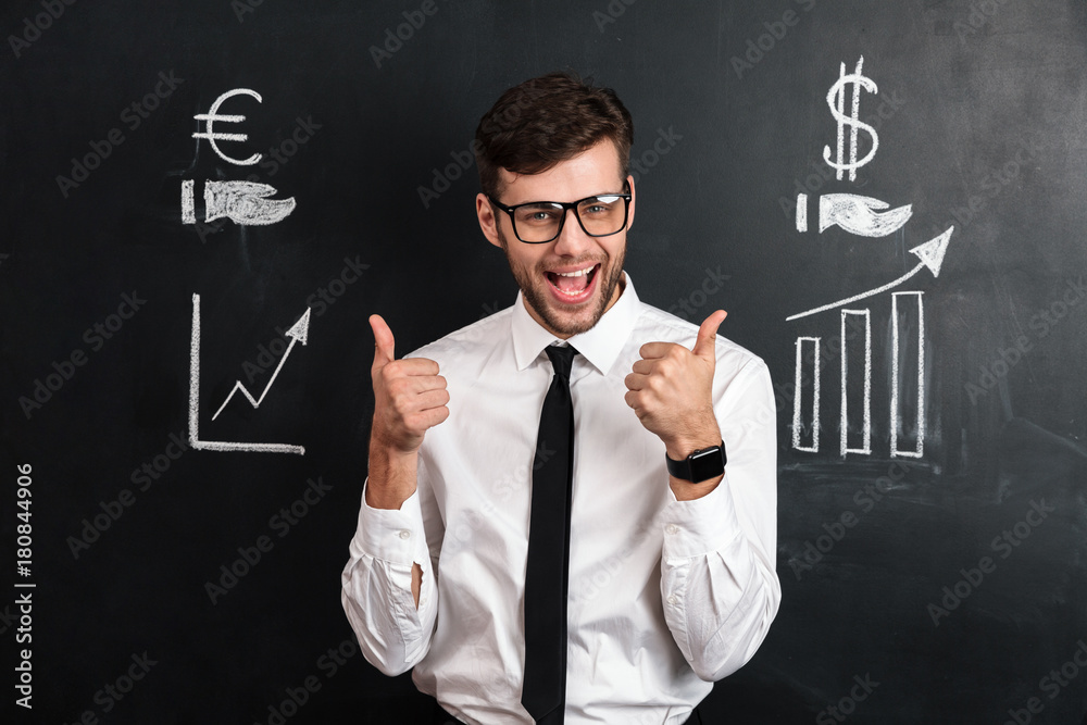 Happy attractive businessman in white shirt showing thumb up gesture with two hands