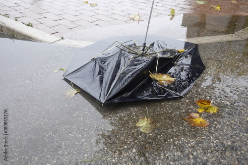 broken umbrella in the puddle