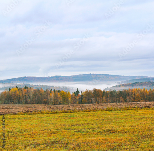 Autumn landscape meadow and colorful trees, Czech landscape