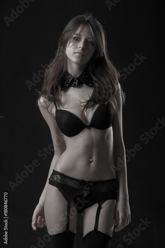 Young pretty woman in black lingerie