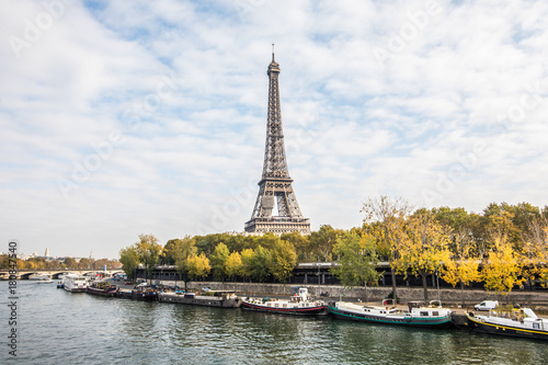 Paris, France - November, 2017. Seine in Paris with Eiffel tower on blue sky