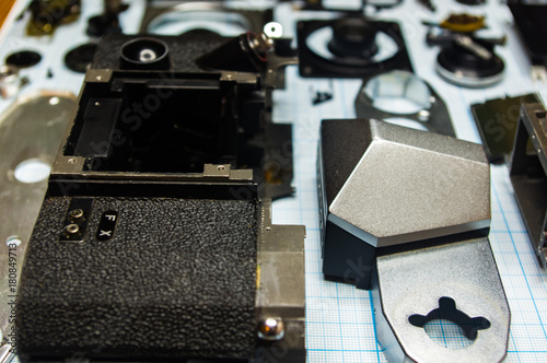 Wallpaper Mural parts old retro film SLR camera on graph paper Torontodigital.ca