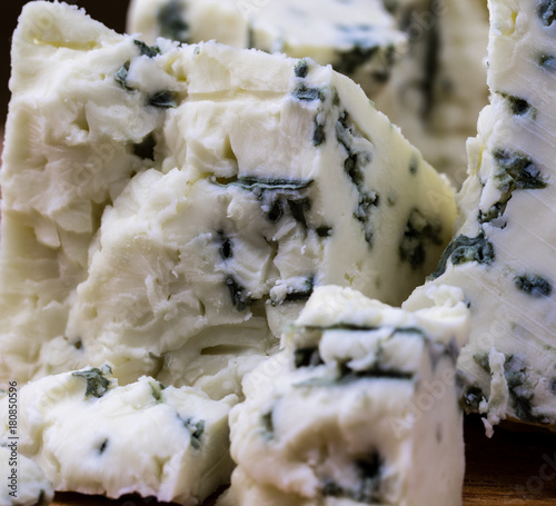 Danish blue cheese close up macro with moldy blue veins. photo