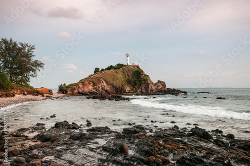 Lighthouse and rock beach at Laem Tanod Cape Koh Lanta, Krabi, Thailand photo