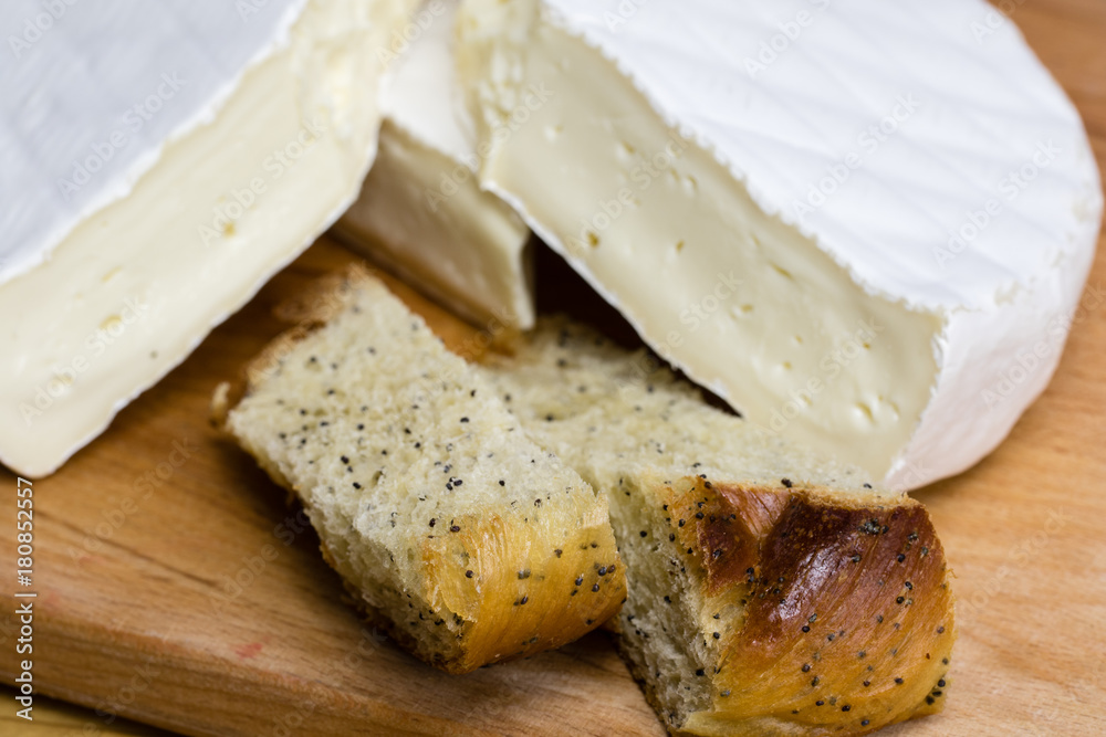 Fresh pastry with poppy seeds excellently paired with Camembert cheese brie .