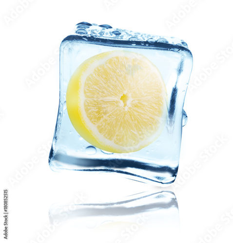 Lemon frozen in ice cube, isolated