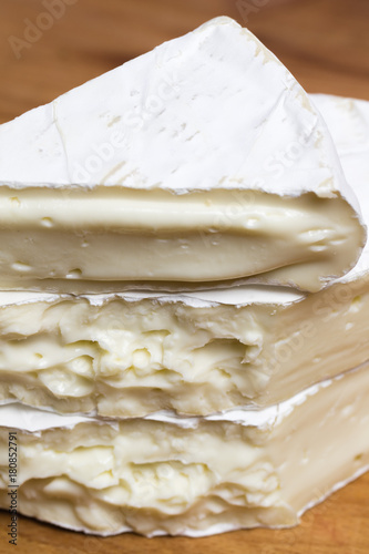 Close up of stacked and melted Camembert cheese brie.
