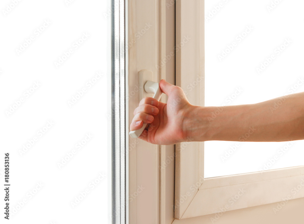 Man hand opens the white plastic the window. Isolated on white background Man hand opens the white plastic the window. Isolated on white background