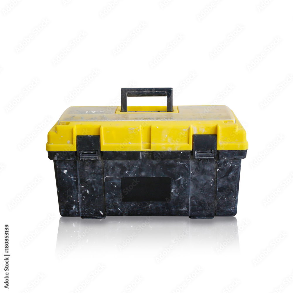 Dirty black box with a yellow lid for tools with a handle. Isolated on white background