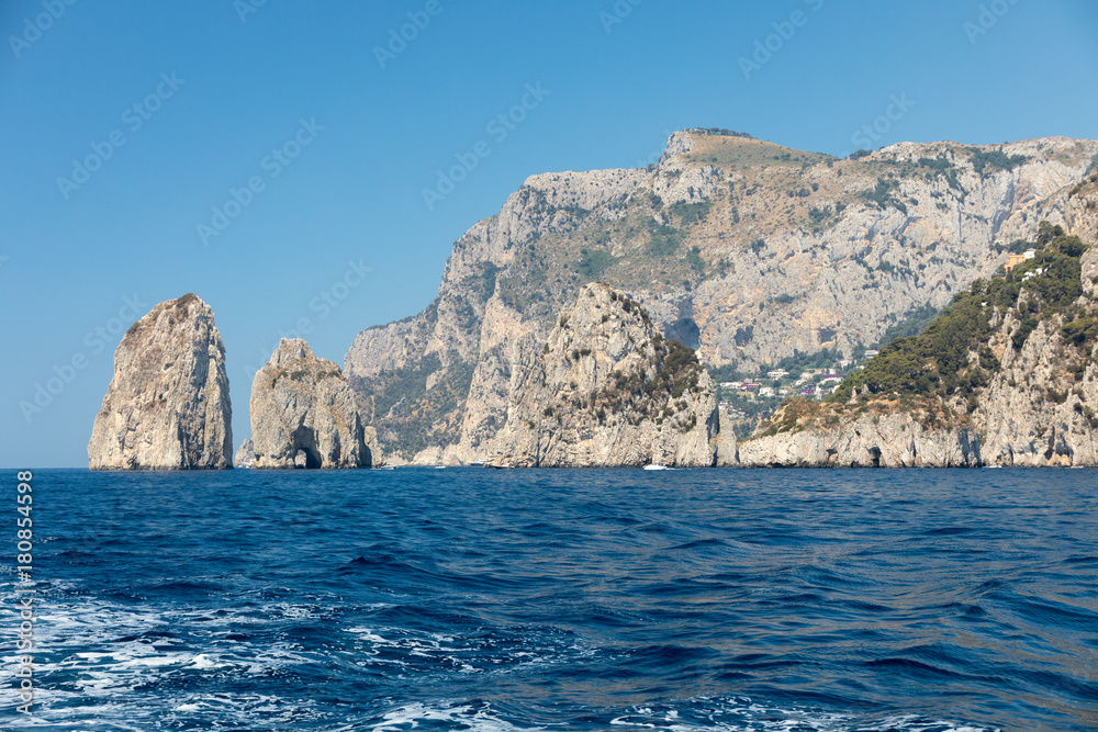 View from the boat on the cliff coast of Capri Island, Italy