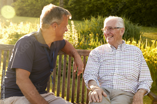 Canvas Print Man Visiting Senior Male Relative In Assisted Living Facility