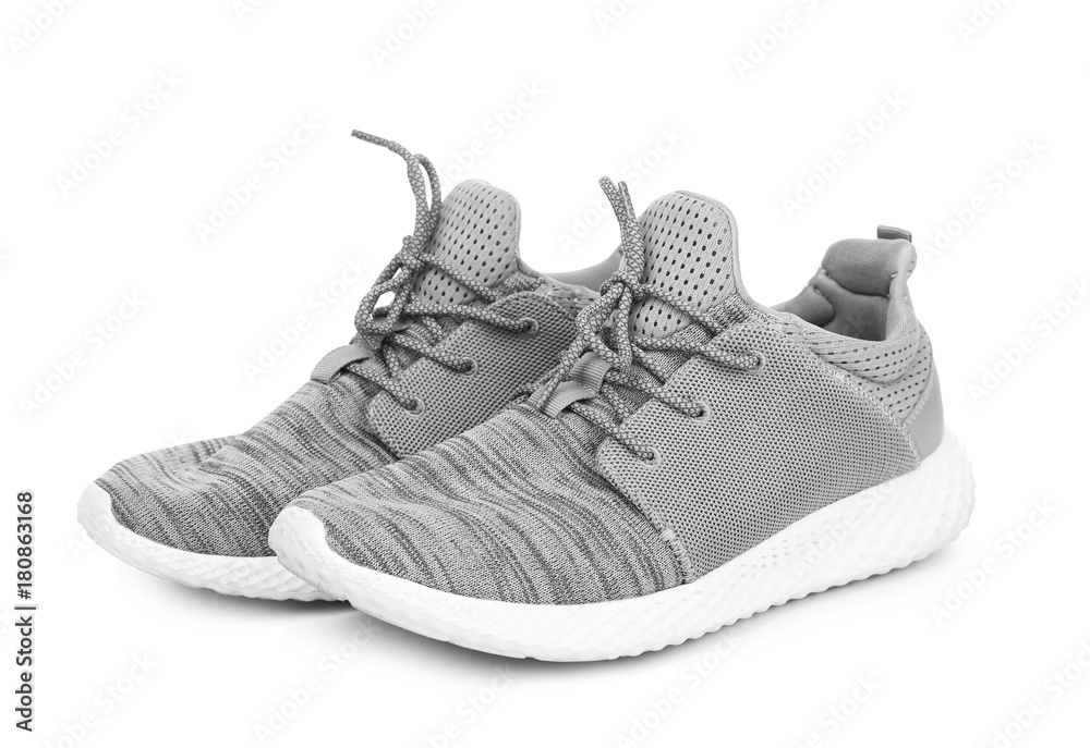 Pair of grey tennis shoes, isolated on white Pair of grey tennis shoes, isolated on white