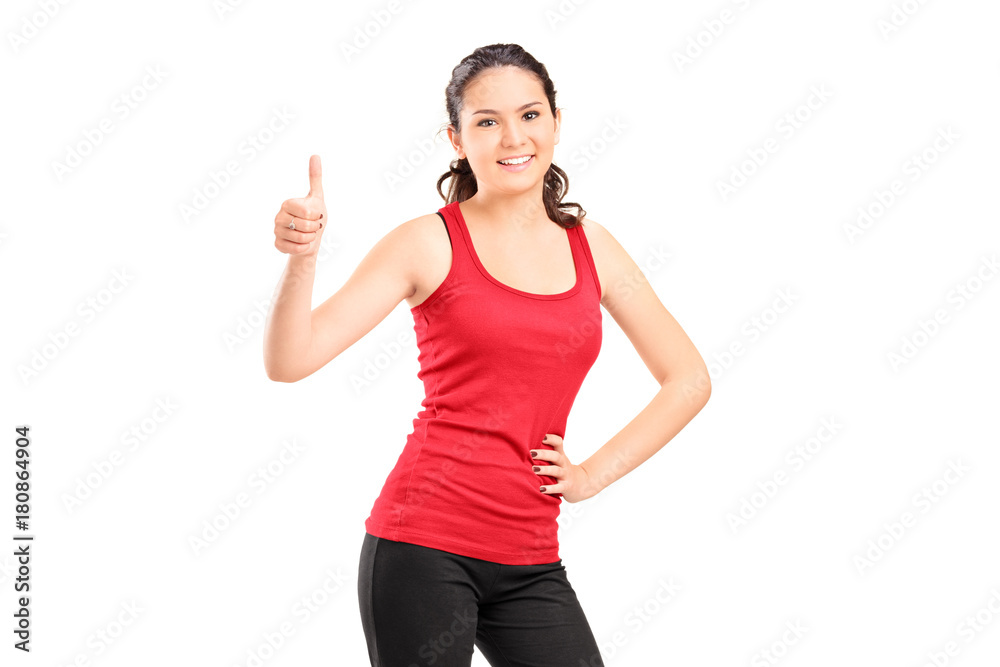 Young woman making a thumb up sign Young woman making a thumb up sign
