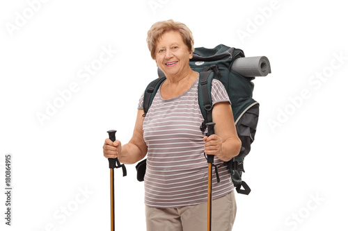 Elderly female hiker with hiking equipment