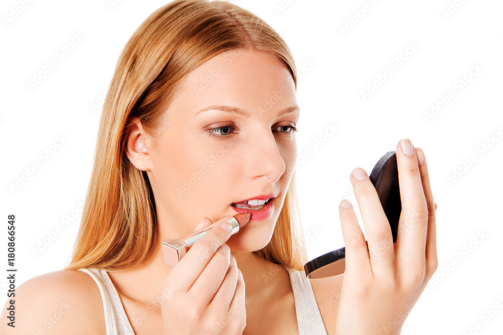Attractive woman doing make-up on face. Isolated Attractive woman doing make-up on face. Isolated
