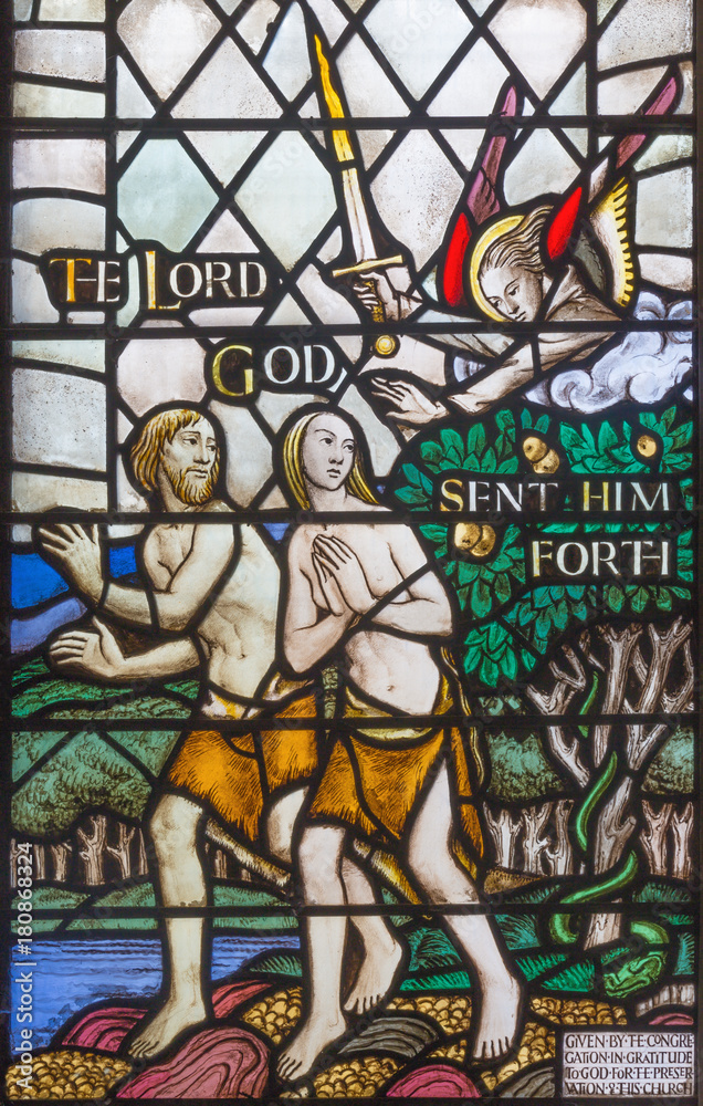 LONDON, GREAT BRITAIN - SEPTEMBER 17, 2017:  The Expulsion of Adam and Eve from Paradise on the stained glass  in church St. Barnabas by Martrin Travers 1945.