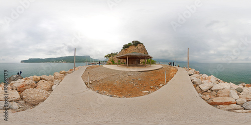 360 degree spherical panorama from Turkey, Antalya, Kemer. Cape of Yoruk park. Seascape with alcove, seafront, stones, fisherman, sea, clouds, mountains, hills. Hdri map photo